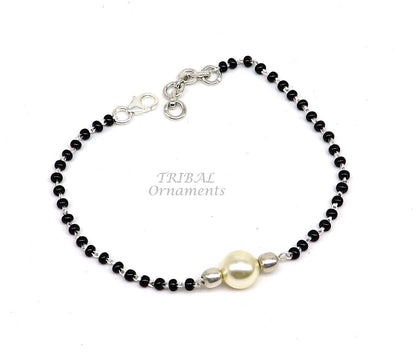 Sterling silver black beaded bracelet and anklet set from Tribal Ornaments, versatile cultural jewelry for all sizes.