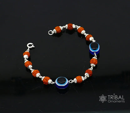 Sterling silver Rudraksha beads with evil eye charm on a stylish unisex handmade bracelet by TRIBAL ORNAMENTS.
