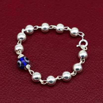 Sterling silver beaded evil eye bracelet by Tribal Ornaments, stylish unisex kids jewelry with handmade beaded design.
