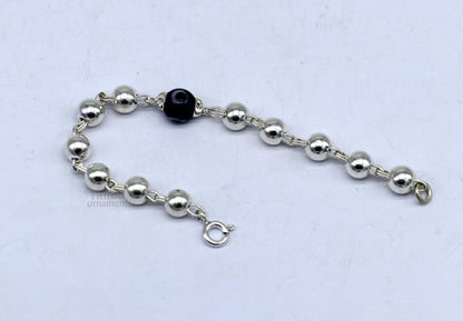 Sterling silver beaded evil eye bracelet by TRIBAL ORNAMENTS, stylish unisex kids jewelry with beaded design and protective evil eye charm.