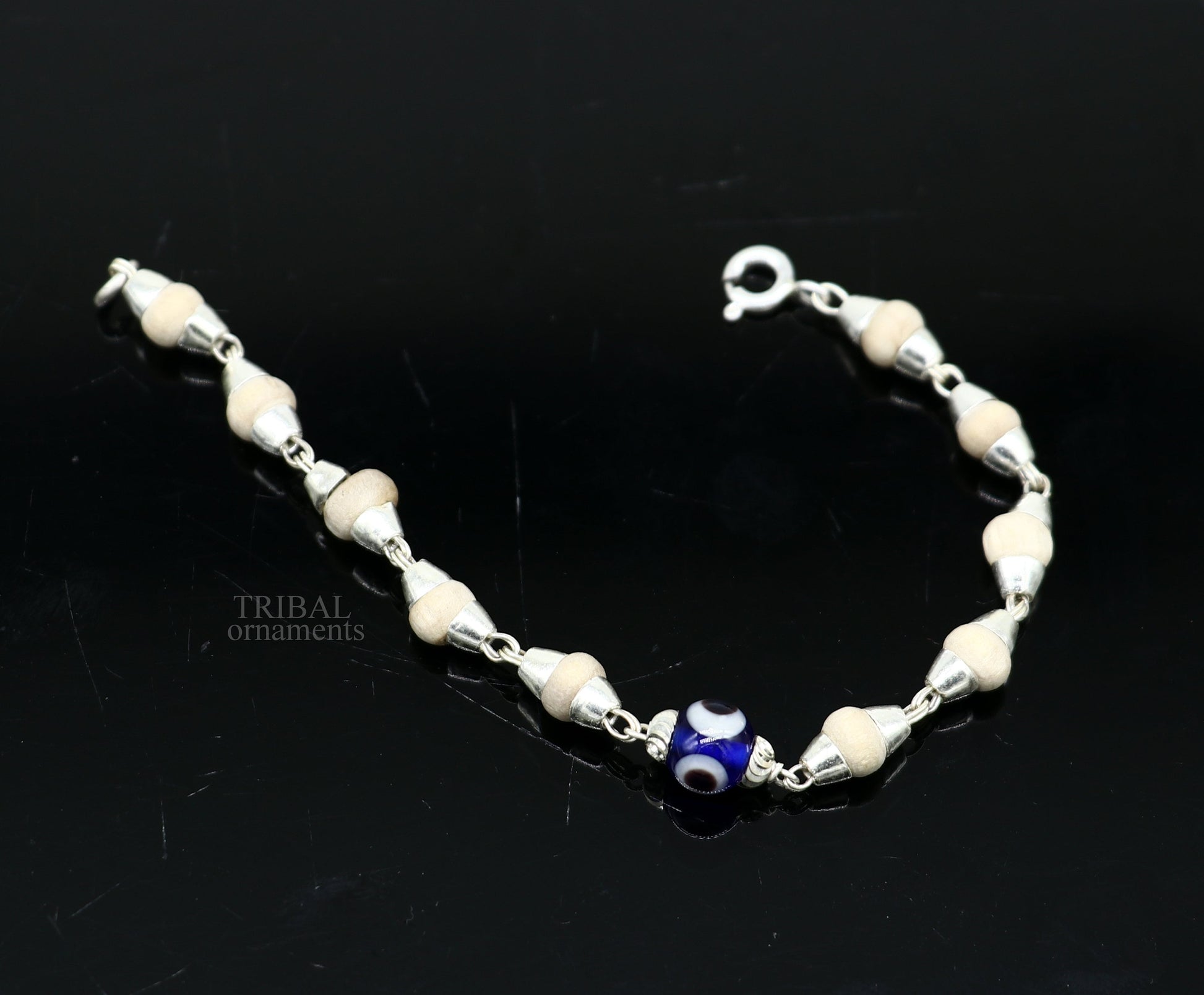 Sterling silver handmade baby Tulsi bracelet with evil eye beads, stylish unisex design by TRIBAL ORNAMENTS.