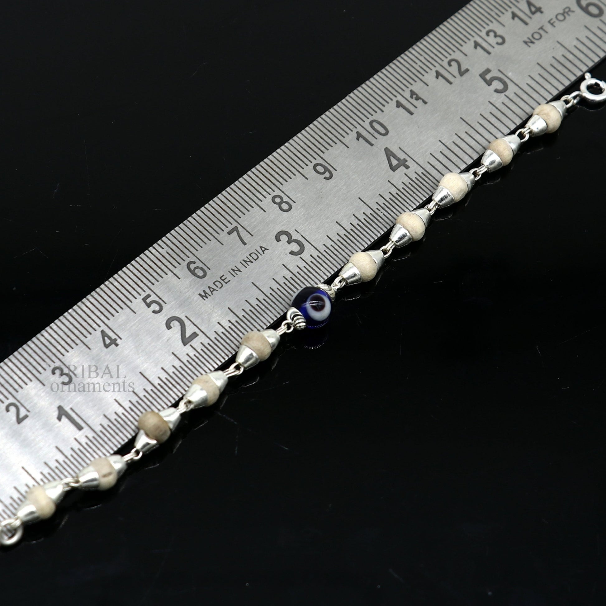 Sterling silver handmade baby Tulsi bracelet with evil eye beads, stylish unisex design from Tribal Ornaments.
