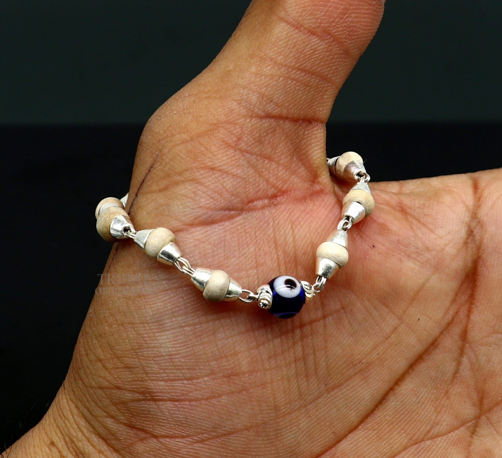 Sterling silver handmade baby Tulsi bracelet with evil eye beads, stylish unisex jewelry by Tribal Ornaments.