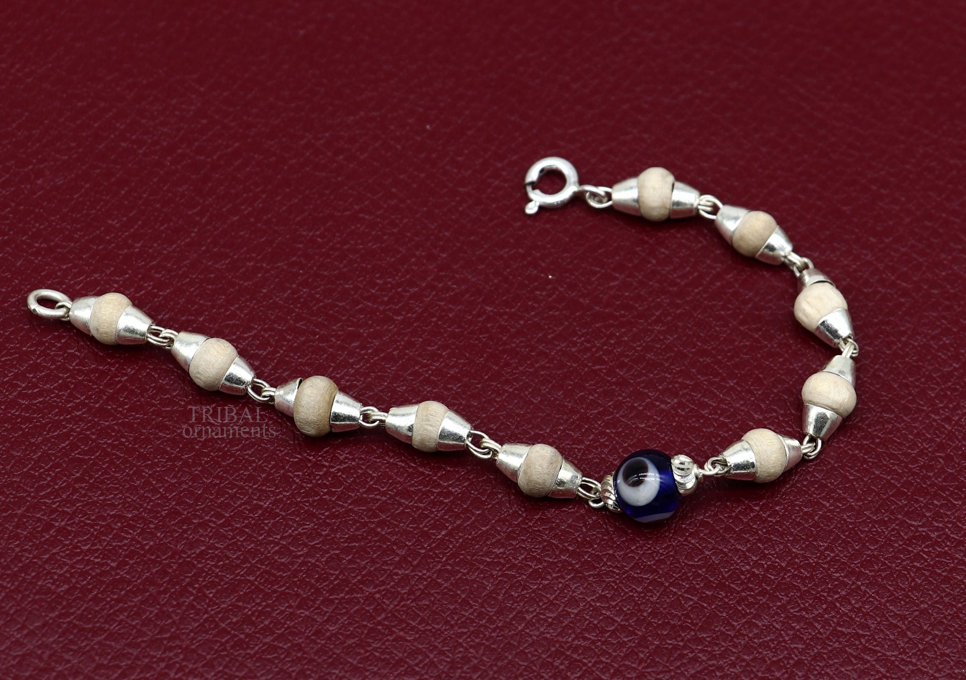 Sterling silver handmade baby Tulsi bracelet with evil eye beads, stylish unisex jewelry by TRIBAL ORNAMENTS, 5-inch size.