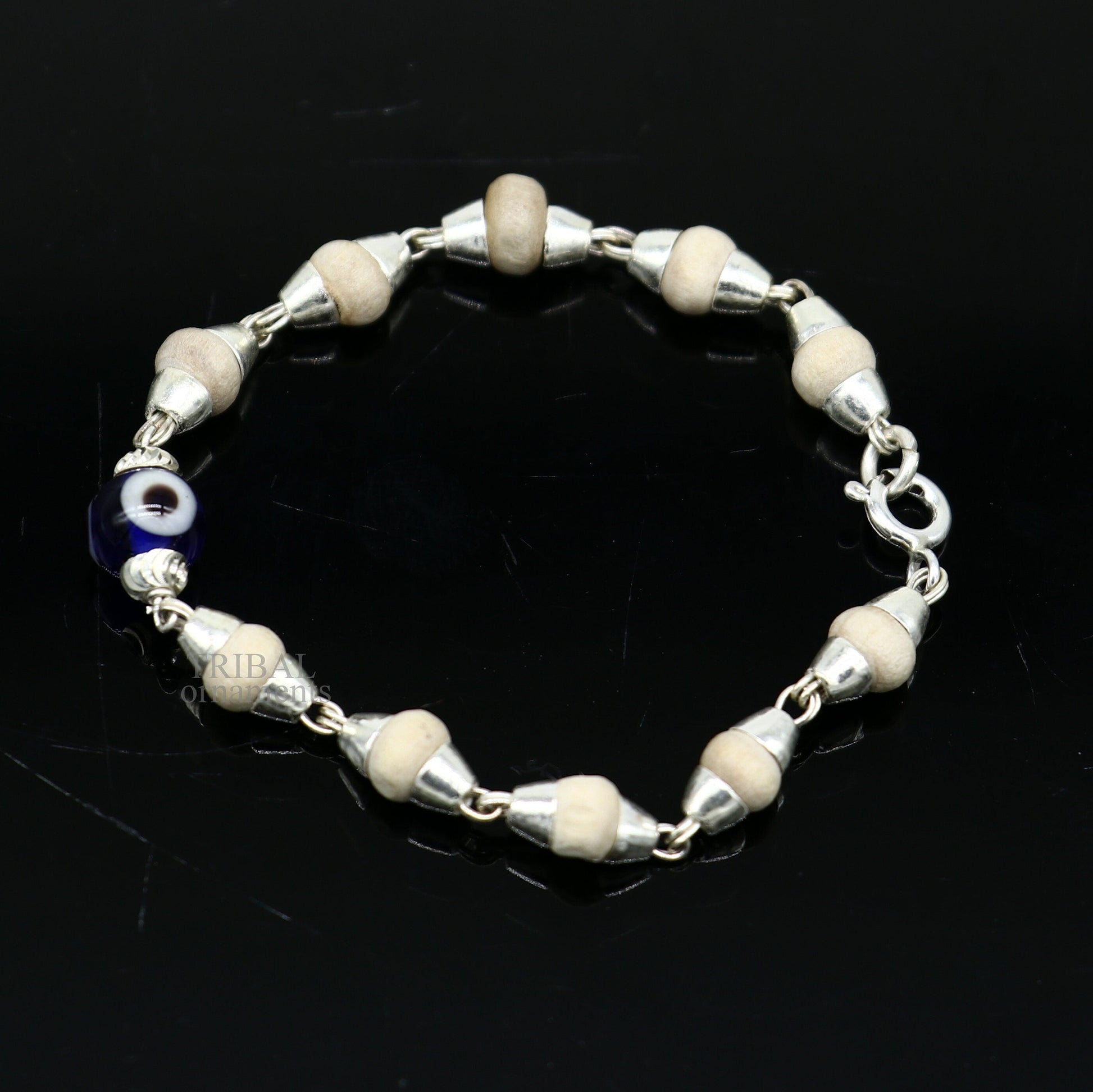 Stylish 925 sterling silver handmade baby Tulsi bracelet with evil eye beads, unisex design by TRIBAL ORNAMENTS.