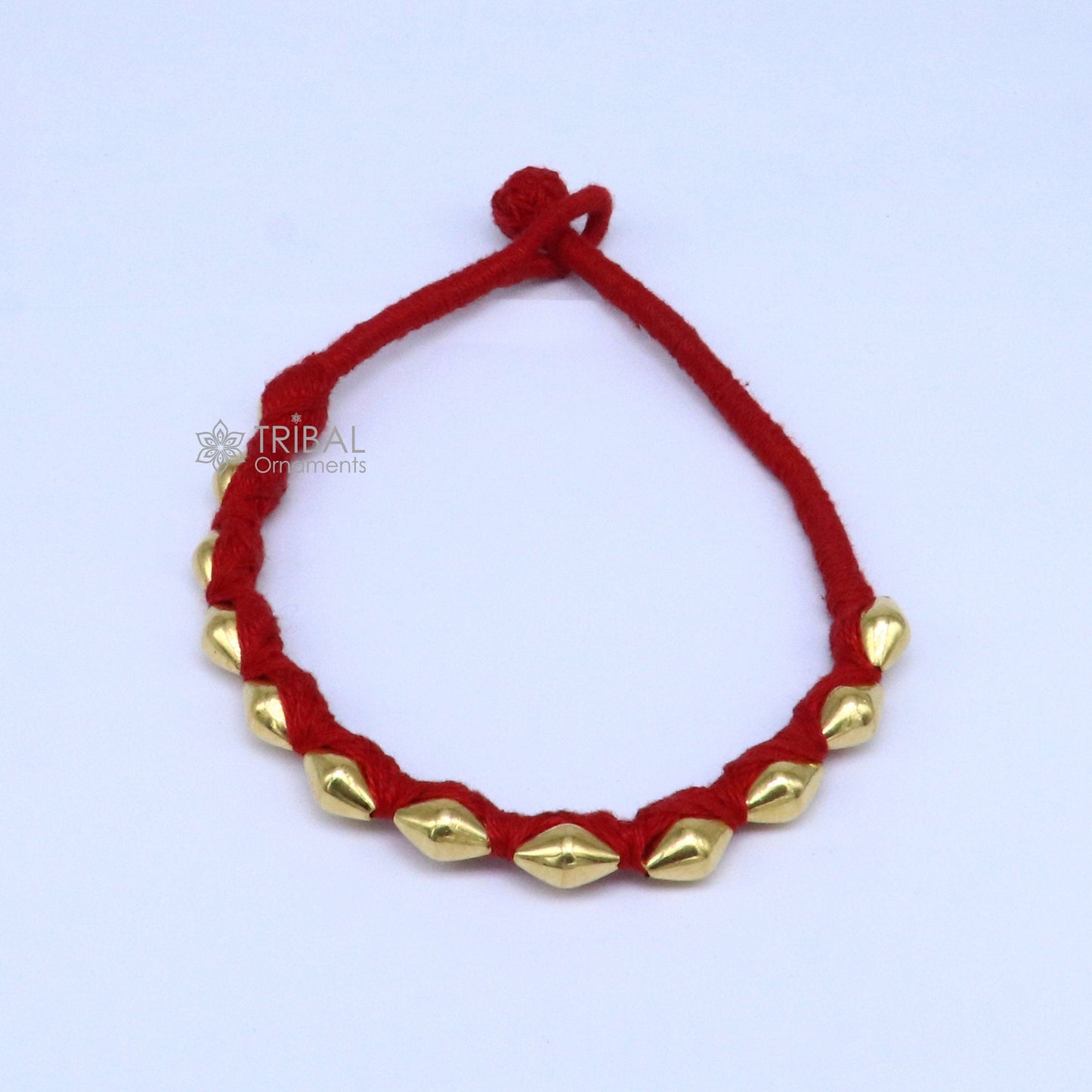 22KT yellow gold handmade dholki beads oval bracelet or anklet featuring custom thread and tribal ethnic design by TRIBAL ORNAMENTS
