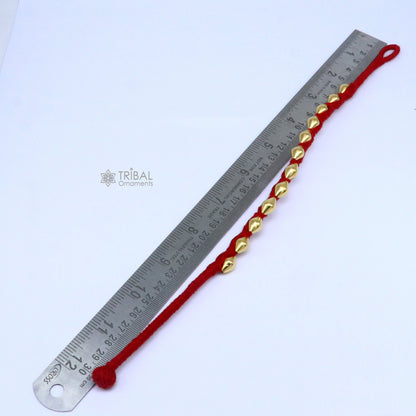22KT yellow gold handmade dholki beads oval-shaped bracelet or anklet with custom thread, tribal ethnic jewelry by TRIBAL ORNAMENTS