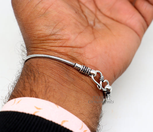 Sterling silver 2mm snake chain bracelet by Tribal Ornaments, flexible unisex vintage jewelry with intricate craftsmanship from Rajasthan.