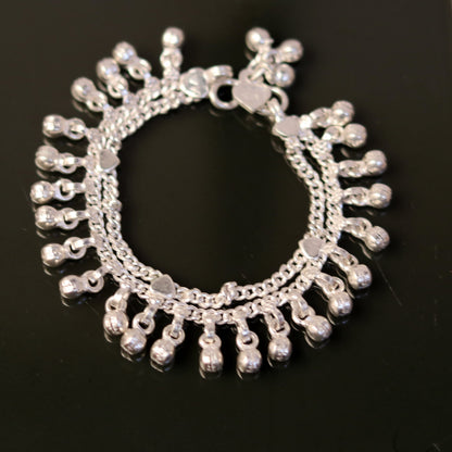 Vintage style sterling silver baby ankle bracelet with jingle bell charms, handmade tribal jewelry for infants and toddlers.