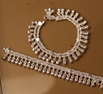 Sterling silver vintage-style baby ankle bracelet with jingle bells, handmade tribal jewelry for infants and toddlers.