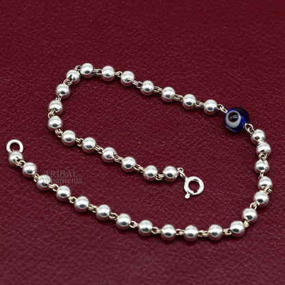 Sterling silver handmade beaded evil eye bracelet by TRIBAL ORNAMENTS, stylish unisex jewelry with colorful beads and protective charm