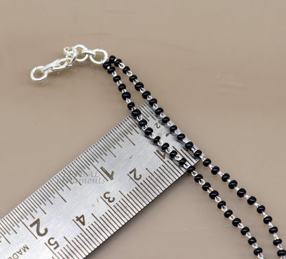 925 sterling silver 2-layer charm bracelet with black beads and silver charms, handcrafted tribal jewelry for women.