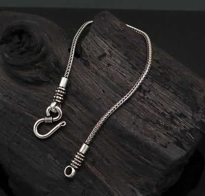 Sterling silver handmade wheat chain bracelet by TRIBAL ORNAMENTS, showcasing an elegant and stylish silver jewelry design.