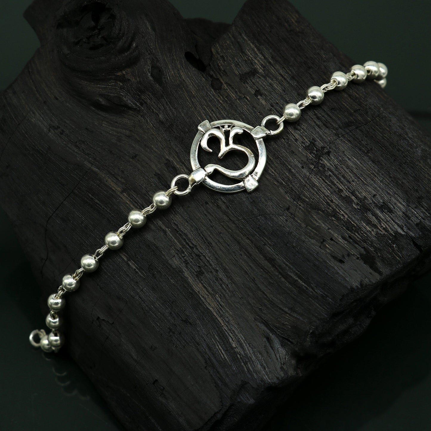925 sterling silver OM beaded bracelet with intricate design, featuring personalized Aum symbol, ideal for rakhi gifting by Tribal Ornaments.