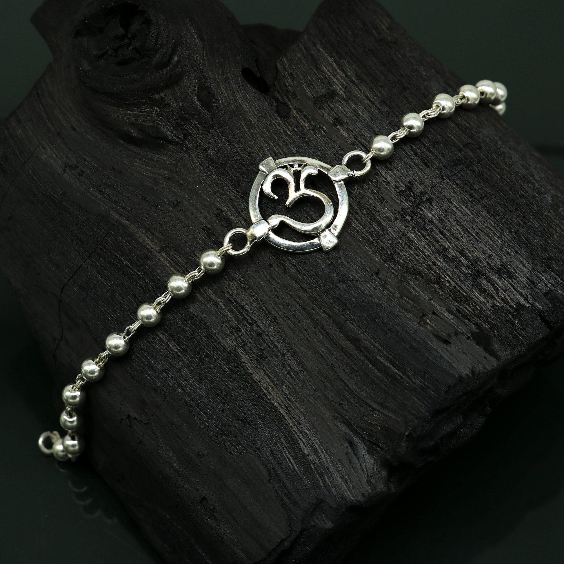 925 sterling silver OM beaded bracelet with intricate design, featuring personalized Aum symbol, ideal for rakhi gifting by Tribal Ornaments.