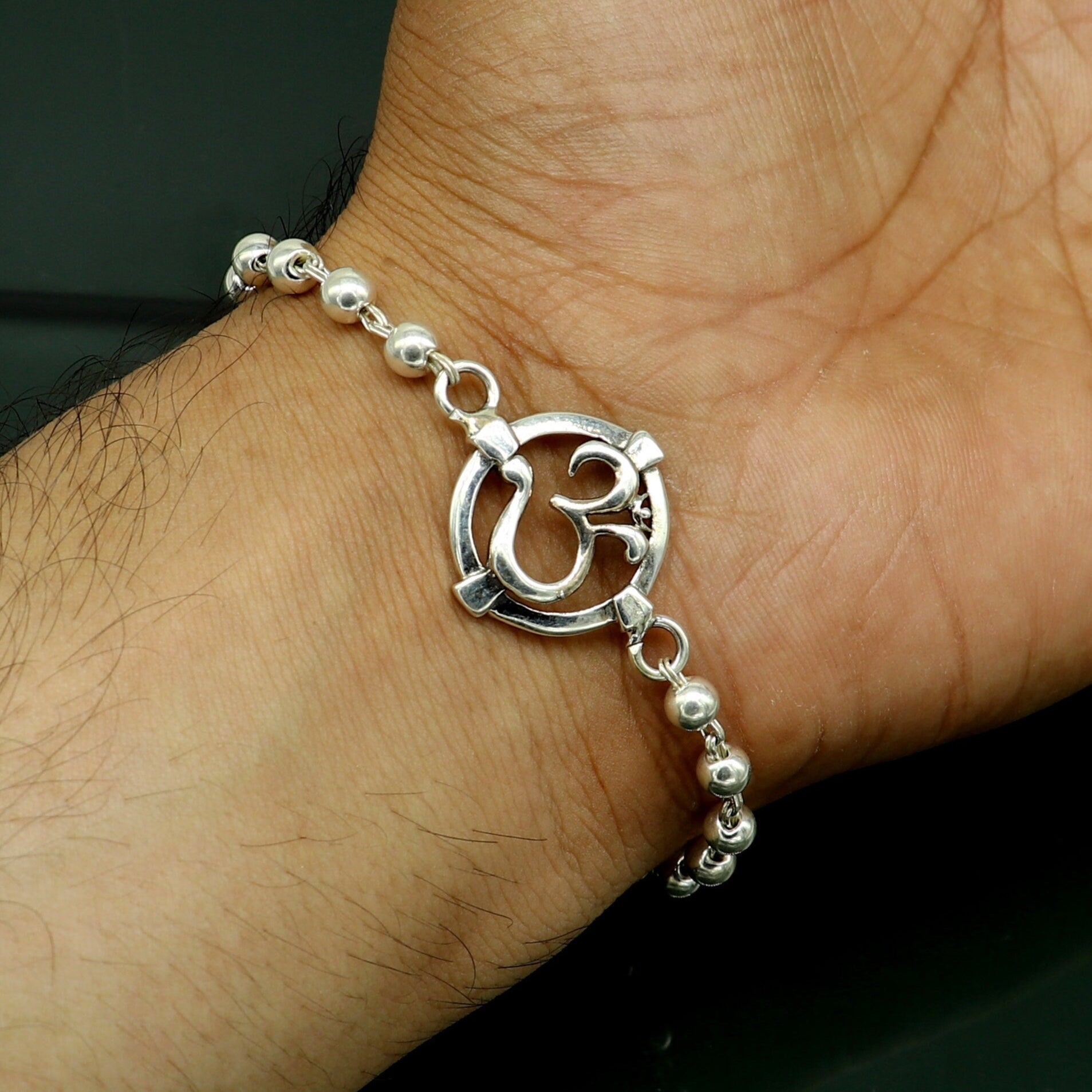 925 sterling silver OM beaded bracelet with tribal design, featuring personalized AUM symbol for traditional gift or jewelry.