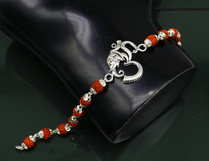 925 Sterling silver customized OM Rudraksha bead bracelet with Aum charm, handcrafted tribal design for spiritual jewelry.