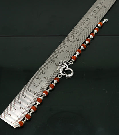 Sterling silver OM Rudraksha bead bracelet with customizable design, featuring a beaded Aum motif and intricate craftsmanship.