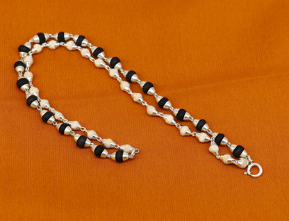 Black and white holy basil rosary plant and Tulsi plant beaded sterling silver handmade bracelet from Tribal Ornaments India.