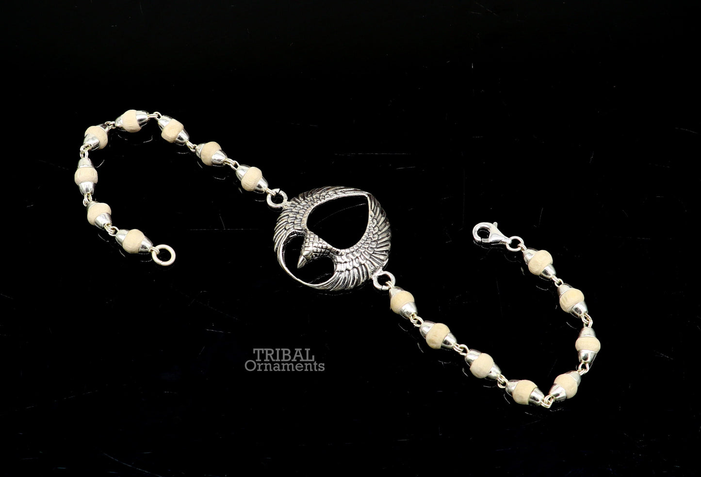 925 sterling silver Lord Garuda Tulsi beaded bracelet rakhi by TRIBAL ORNAMENTS featuring black basil beads and intricate Garuda design.