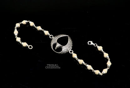925 sterling silver Lord Garuda Tulsi beaded bracelet rakhi by TRIBAL ORNAMENTS featuring black basil beads and intricate Garuda design.