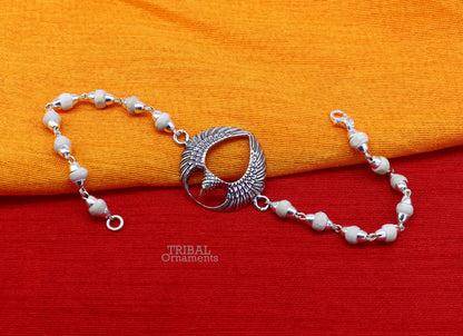 925 sterling silver Lord Garuda design Tulsi beaded bracelet rakhi by TRIBAL ORNAMENTS featuring black basil beads and intricate silver details.