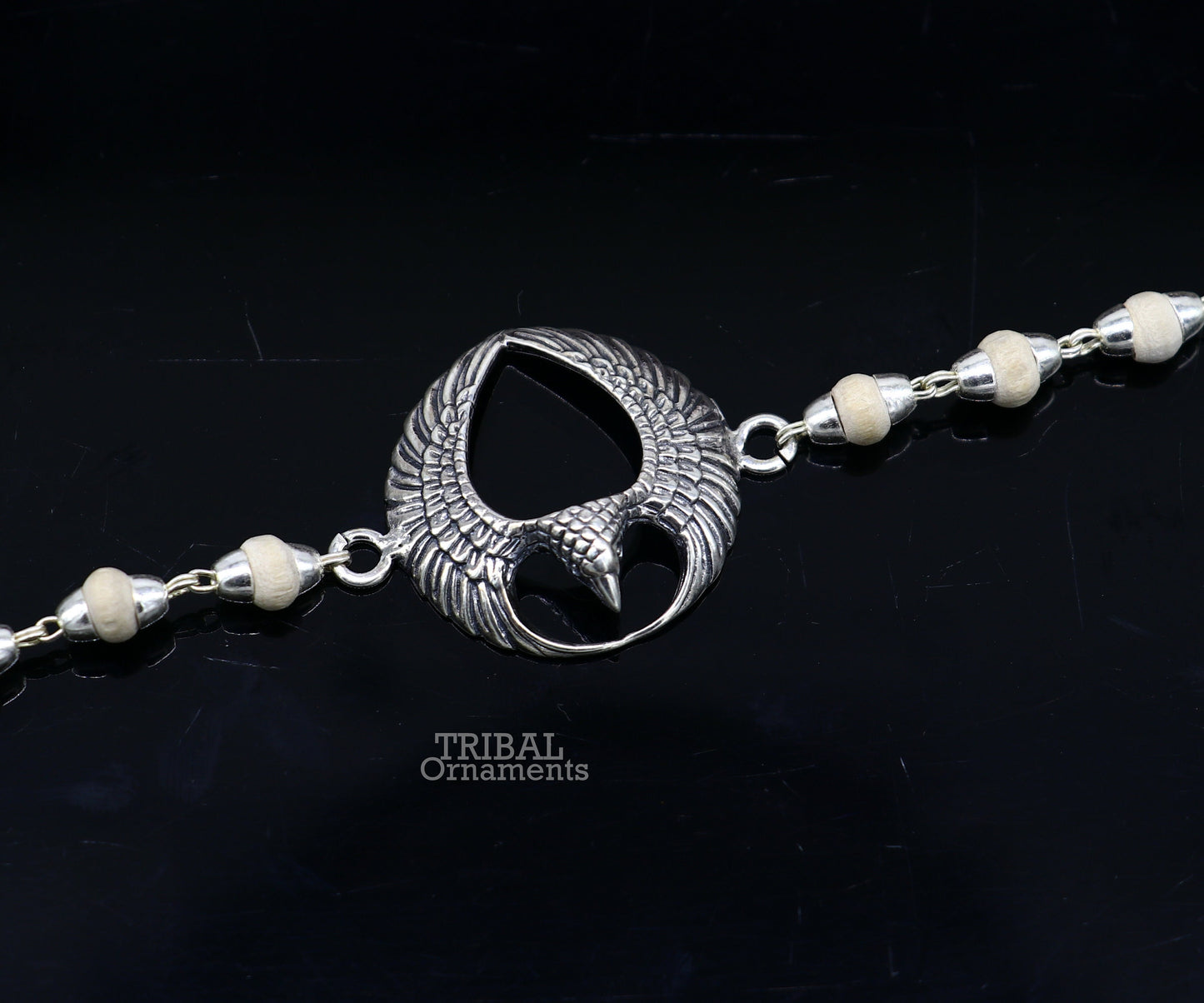 925 sterling silver Lord Garuda tulsi beaded bracelet rakhi with Basil design from TRIBAL ORNAMENTS, featuring black basil beads.