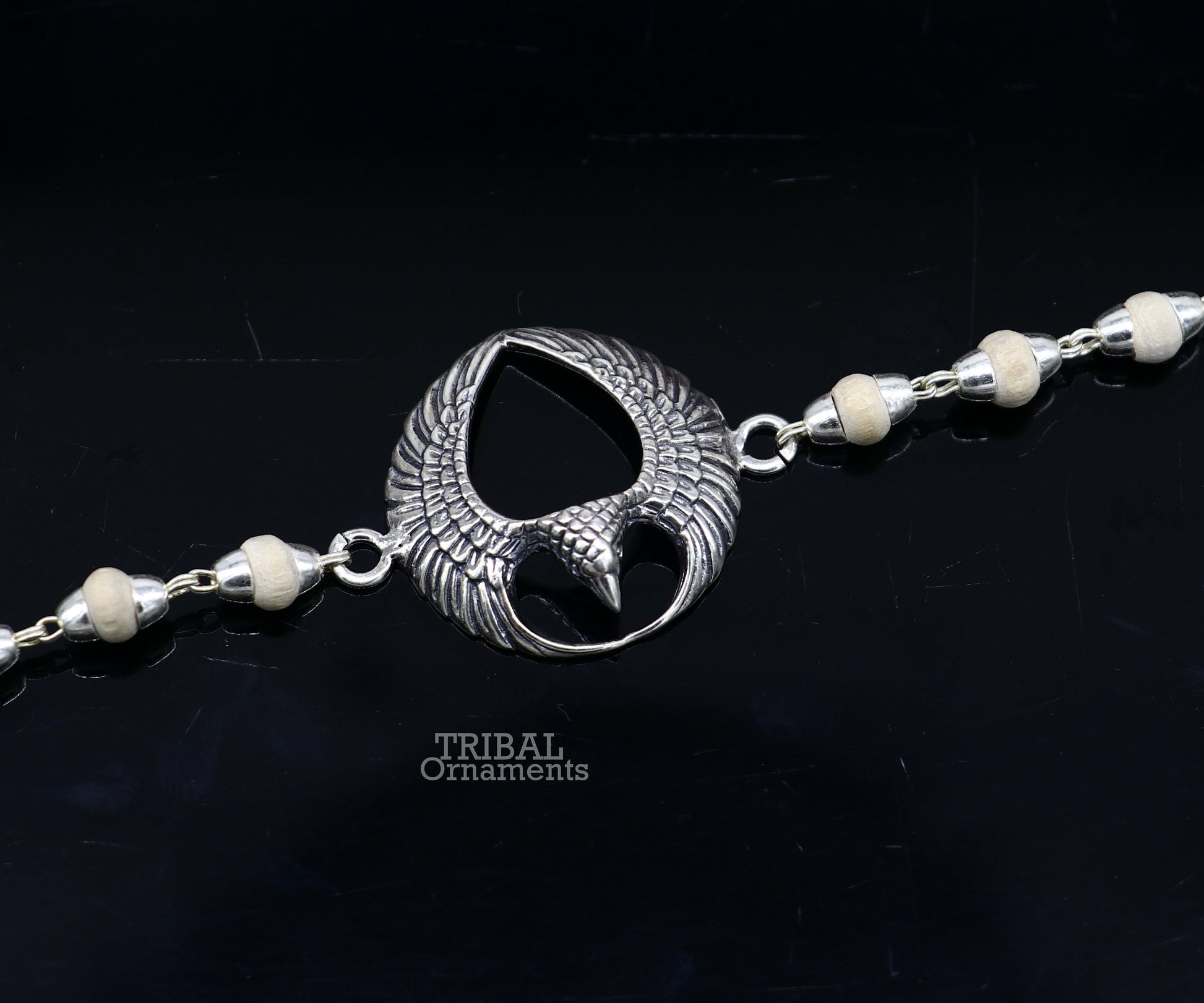 925 sterling silver Lord Garuda tulsi beaded bracelet rakhi with Basil design from TRIBAL ORNAMENTS, featuring black basil beads.
