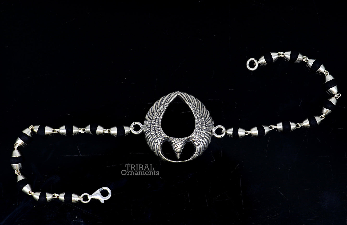925 sterling silver Lord Garuda design Tulsi beaded bracelet rakhi by TRIBAL ORNAMENTS with black basil beads and intricate silver details.