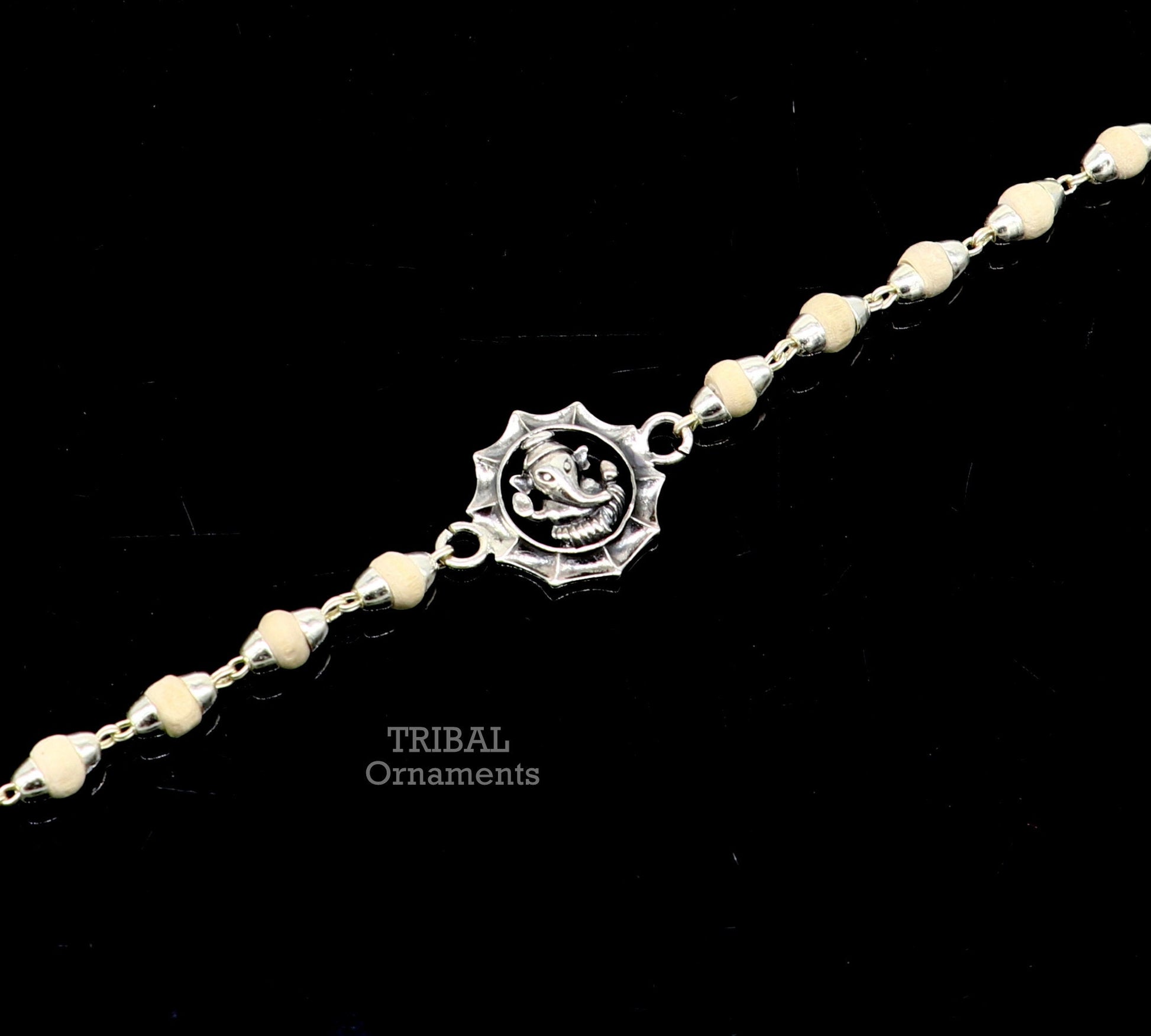 925 sterling silver Lord Ganesha design Tulsi beads bracelet rakhi with black basil and handmade detailing by Tribal Ornaments.