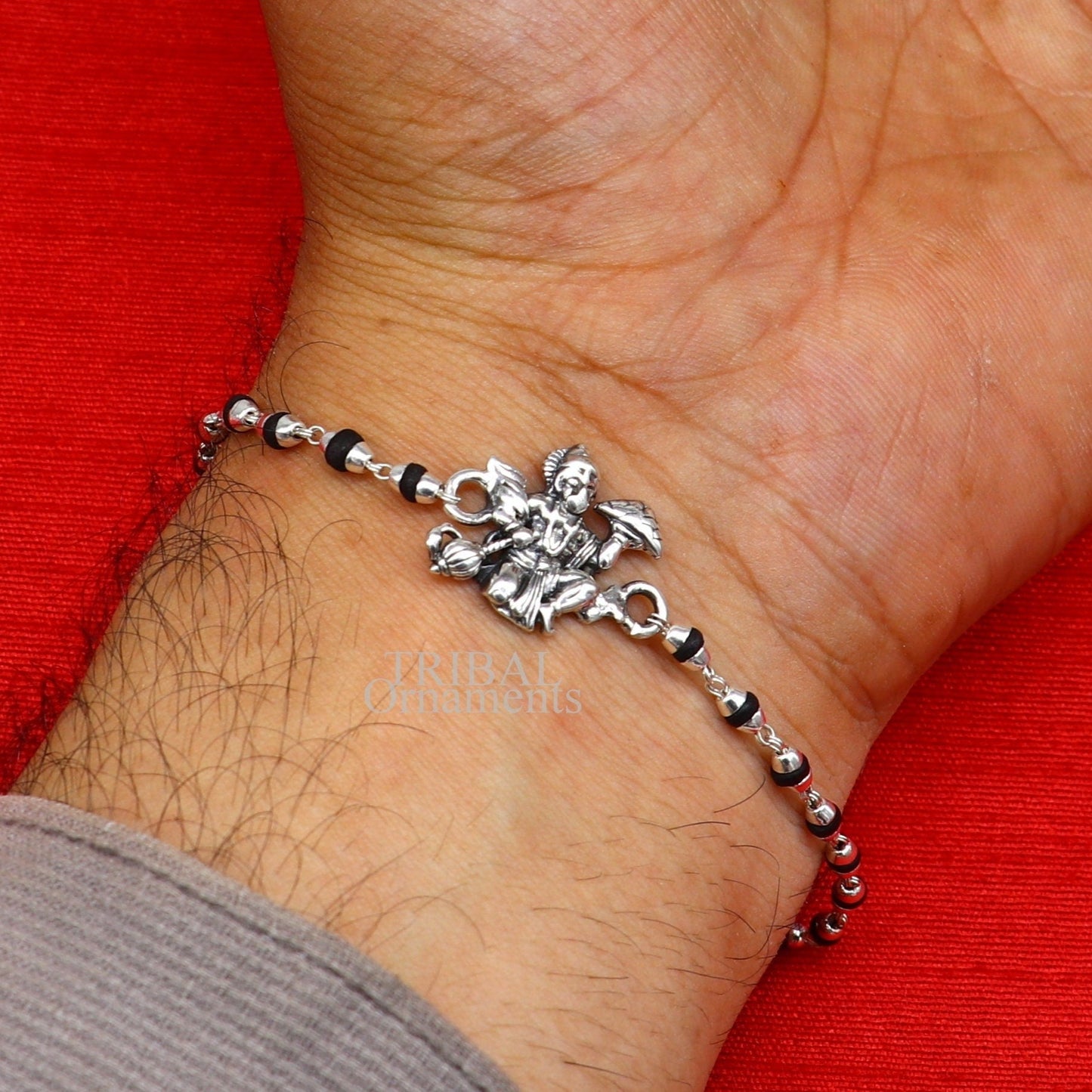 Handmade Lord Hanuman holy basil rosary beads bracelet with 925 sterling silver beads, featuring black Tulsi beads and intricate design.
