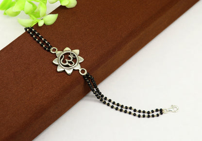 Sterling silver customized OM beaded bracelet with black beads, 6 to 8.5 inches, from TRIBAL ORNAMENTS.
