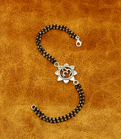 Sterling silver OM design black beaded bracelet with personalized customization, crafted by TRIBAL ORNAMENTS.