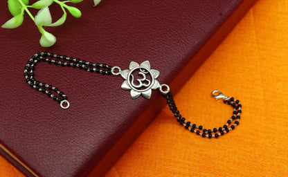 Sterling silver black beaded bracelet with customized OM design, 6 to 8.5 inches, by TRIBAL ORNAMENTS.
