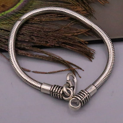Vintage-style 4.5mm sterling silver snake chain bracelet with tribal-inspired custom design, unisex handmade jewelry.