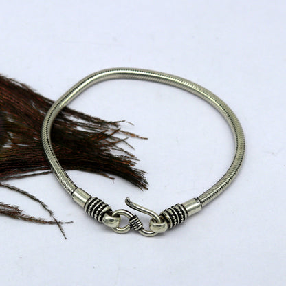 Vintage-style 925 sterling silver snake chain bracelet by TRIBAL ORNAMENTS, unisex, handmade tribal jewelry with customized design.