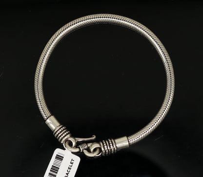 Sterling silver handmade snake chain bracelet, flexible and customizable, unisex tribal jewelry with detailed silver craftsmanship.