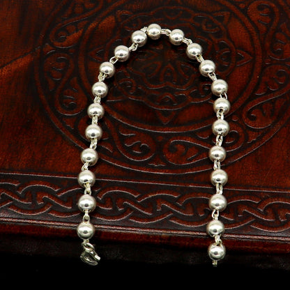Sterling silver unisex beaded bracelet with 5.5mm round beads, handmade by Tribal Ornaments, 8-inch stylish jewelry accessory.