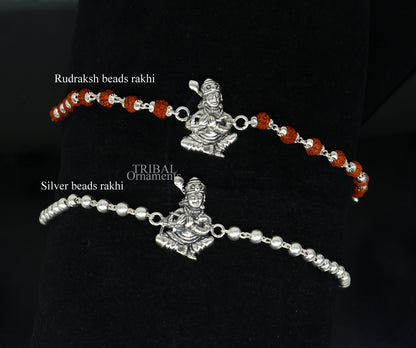 925 Sterling silver Lord Krishna design Rudraksha beads bracelet rakhi with intricate detailing by TRIBAL ORNAMENTS.