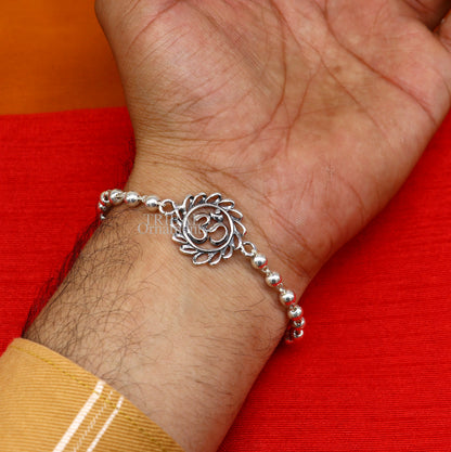 925 Sterling silver OM Rudraksha bracelet with silver beads, featuring divine Aum symbol, designed as a traditional rakhi ornament.