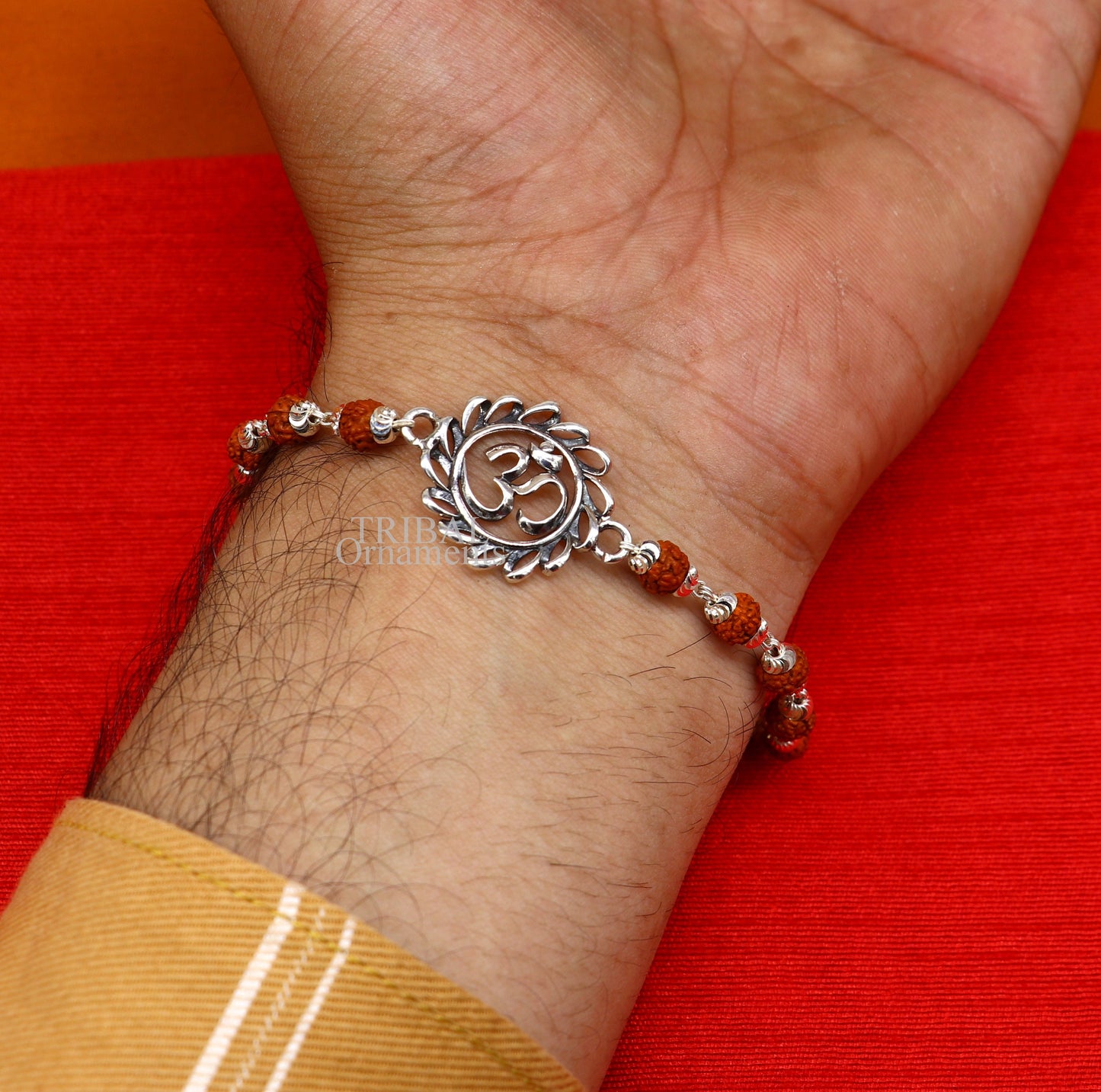 925 Sterling silver OM Rudraksha bracelet with silver beads, featuring a divine Aum design, from Tribal Ornaments.