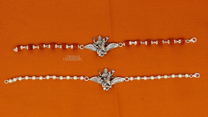 Sterling silver Lord Vishnu bracelet with Garuda, Rudraksha beads, and silver accents, crafted by TRIBAL ORNAMENTS.