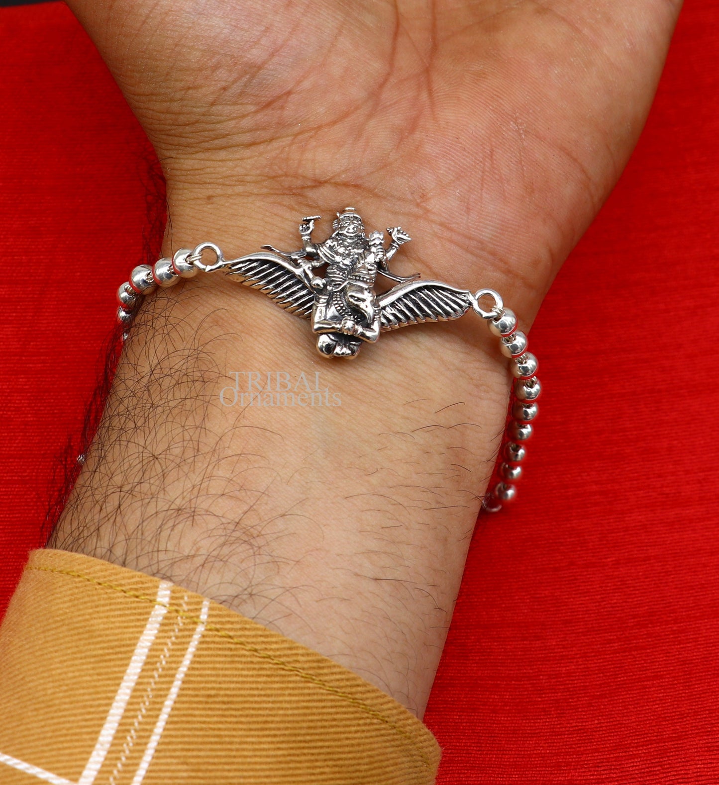 Sterling silver Lord Vishnu bracelet with Garuda, Rudraksha beads, and silver beads, crafted by Tribal Ornaments.