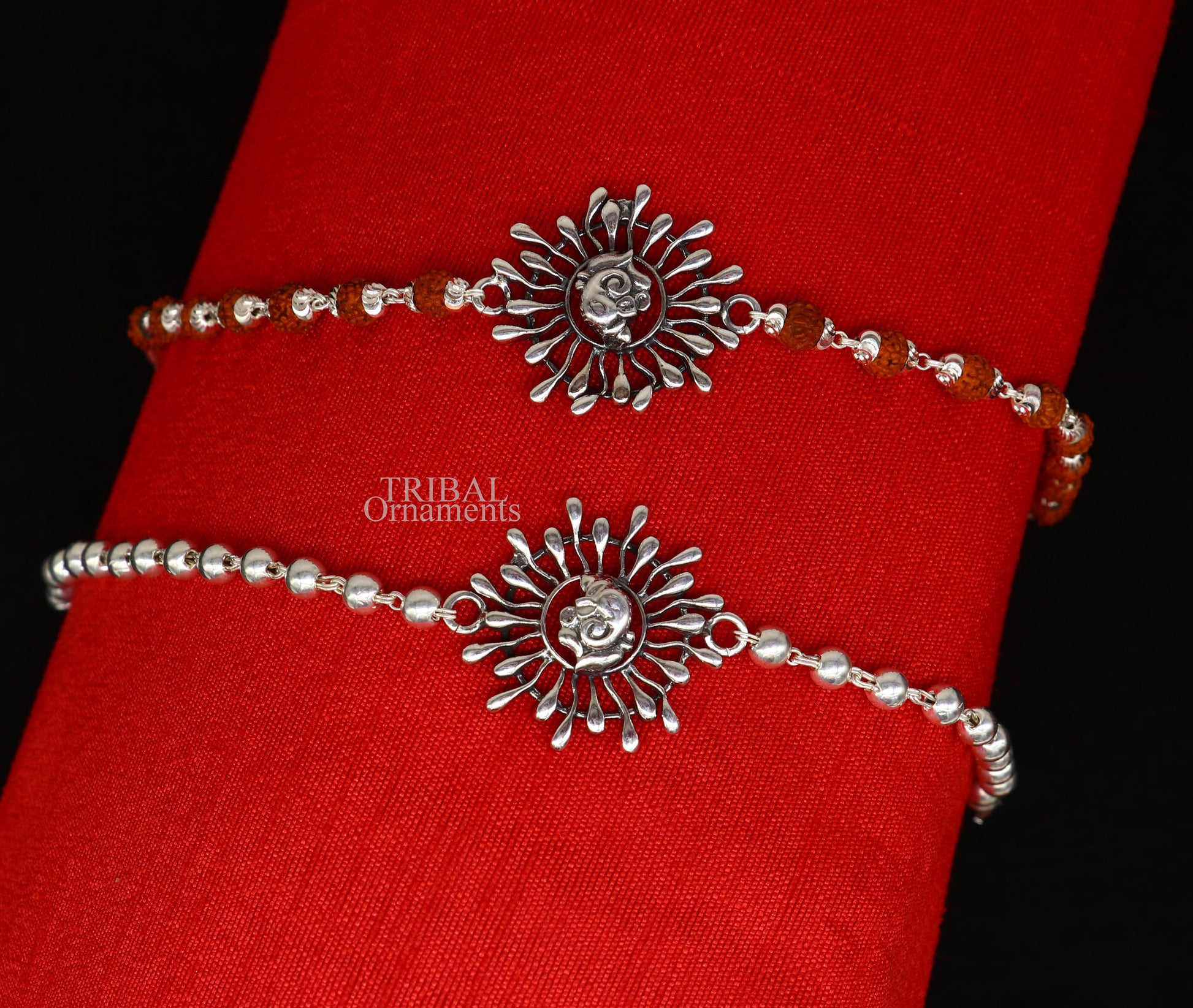 925 Sterling silver Ganesha design Rudraksha beads bracelet rakhi with intricate Ganesha detail and black Rudraksha beads.