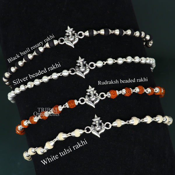 Handmade 925 sterling silver Lord Ganesha design Rudraksha and Tulsi beads bracelet rakhi with intricate craftsmanship.