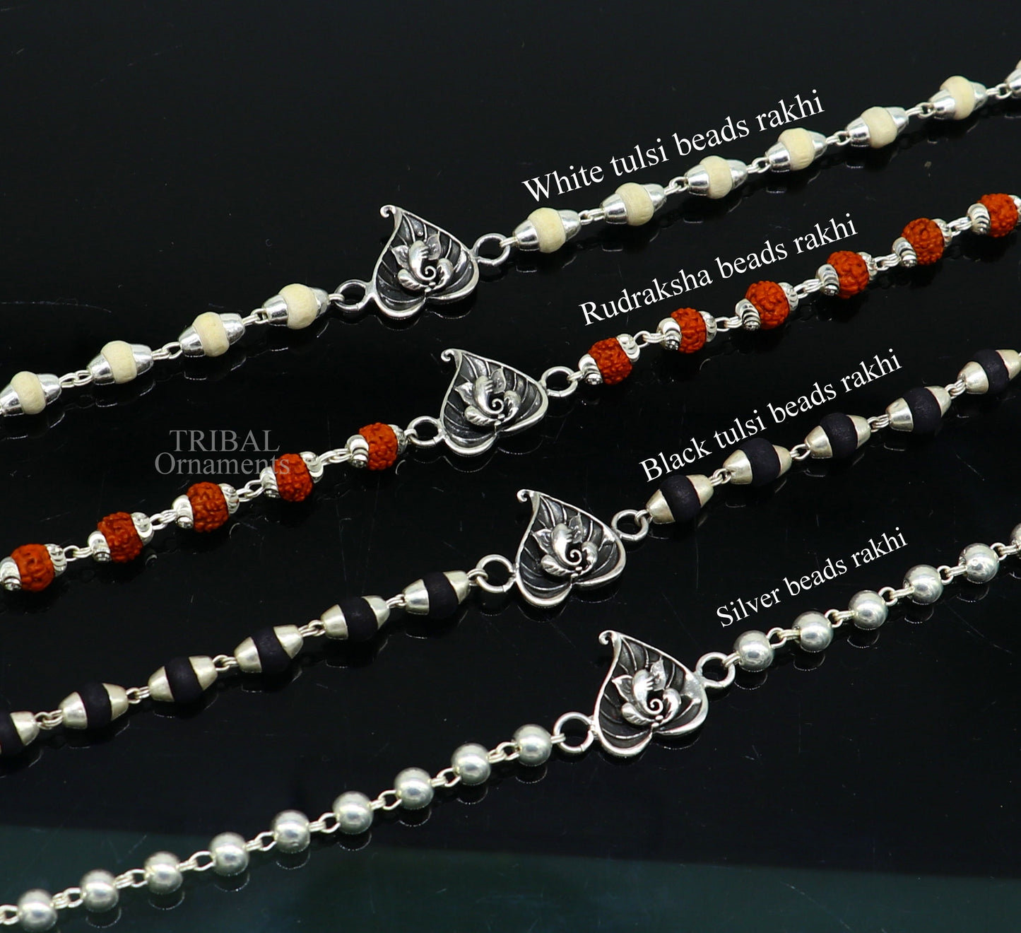 Sterling silver Lord Ganesha on Paan design Rudraksha and Tulsi bead bracelet with handmade craftsmanship and intricate details.