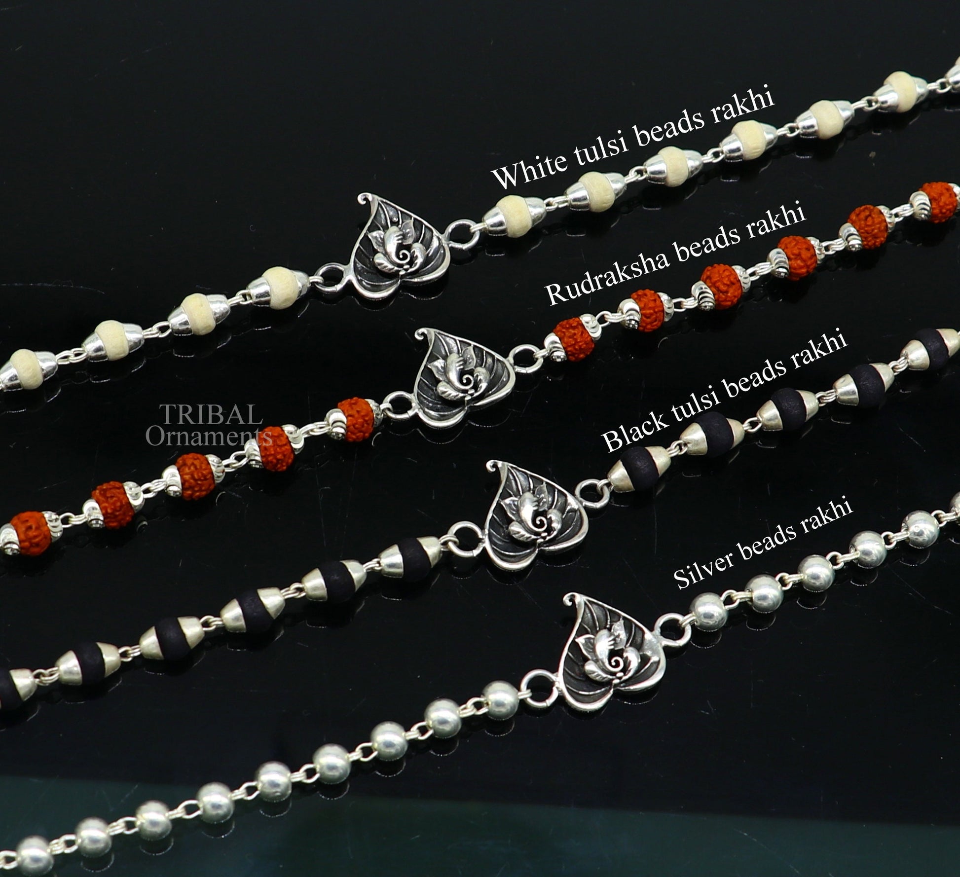 Sterling silver Lord Ganesha on Paan design Rudraksha and Tulsi bead bracelet with handmade craftsmanship and intricate details.