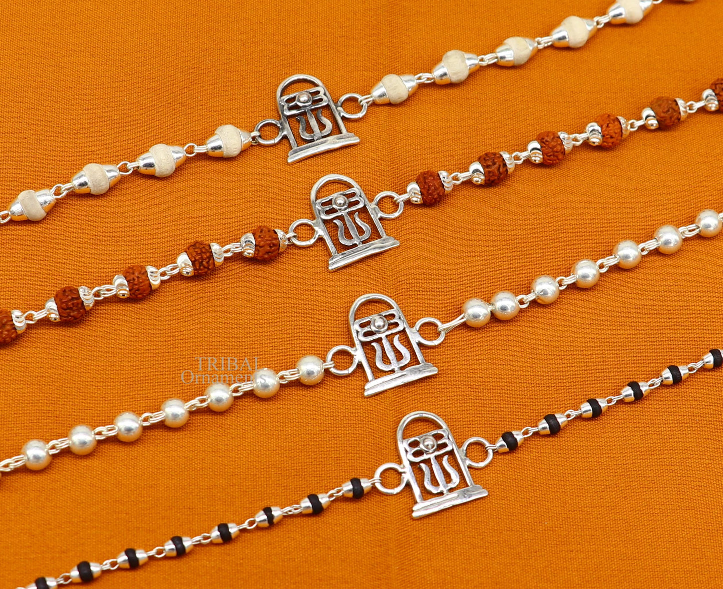 Sterling silver Lord Shiva Lingam Rudraksha and Tulsi beaded bracelet with handmade tribal design by TRIBAL ORNAMENTS.