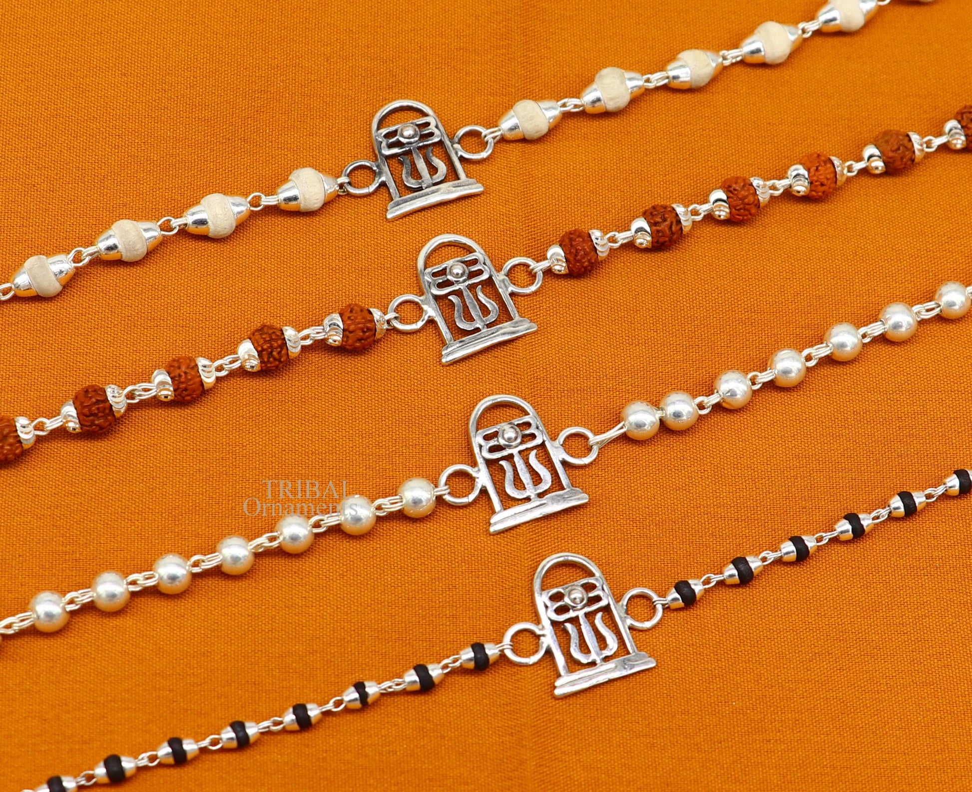 Sterling silver Lord Shiva Lingam Rudraksha and Tulsi beaded bracelet with handmade tribal design by TRIBAL ORNAMENTS.
