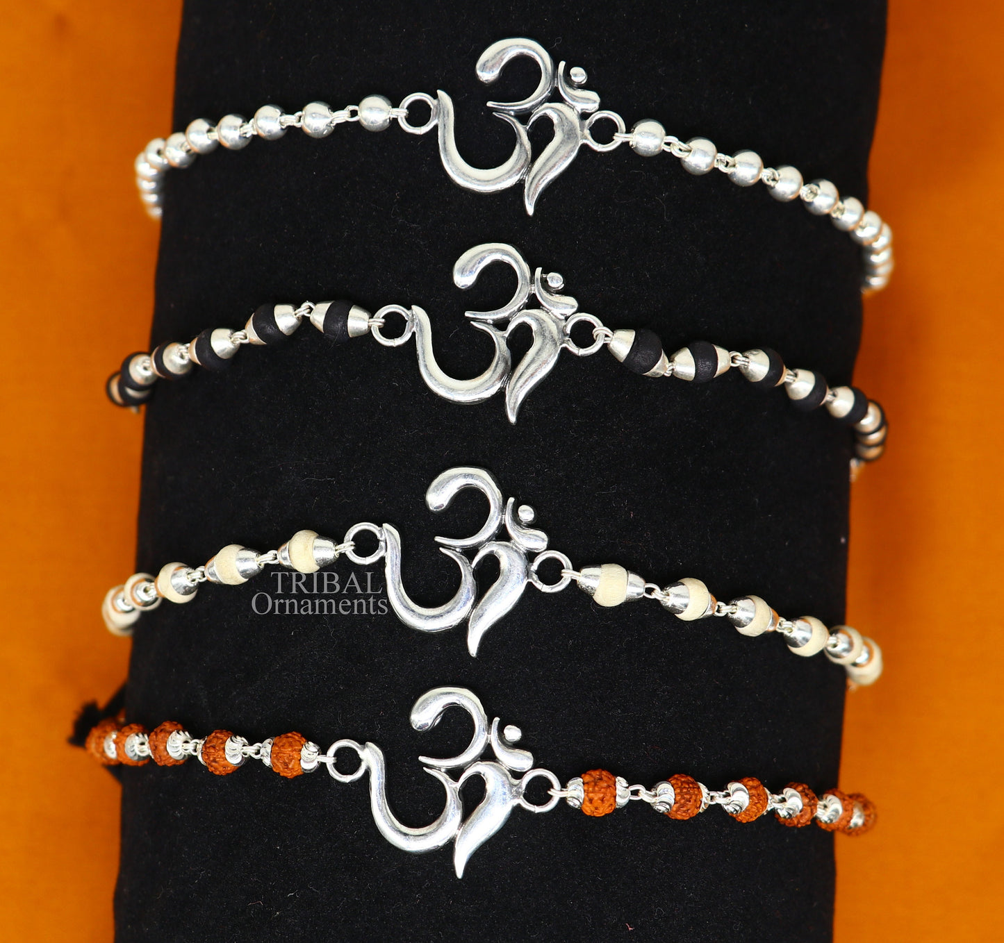 925 sterling silver Rudraksha and Tulsi beaded bracelet with OM design, handmade tribal ornaments for spiritual wrist adornment.
